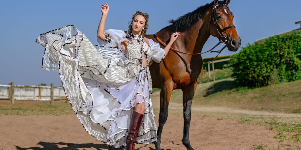 South African actress and singer Anlia Etzebeth, who will be singing the National Anthem on Saturday at the Hollywoodbets Durban July, is pictured alongside Wish List, one of the Hollywoodbets Durban July favourites, at Summerveld on Wednesday. Photo credit: Chase Liebenberg